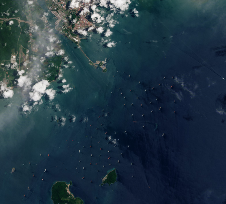 Satellite image of dozens of cargo ships waiting at anchor off the Pacific approach to the Panama Canal during the August 2023 drought
